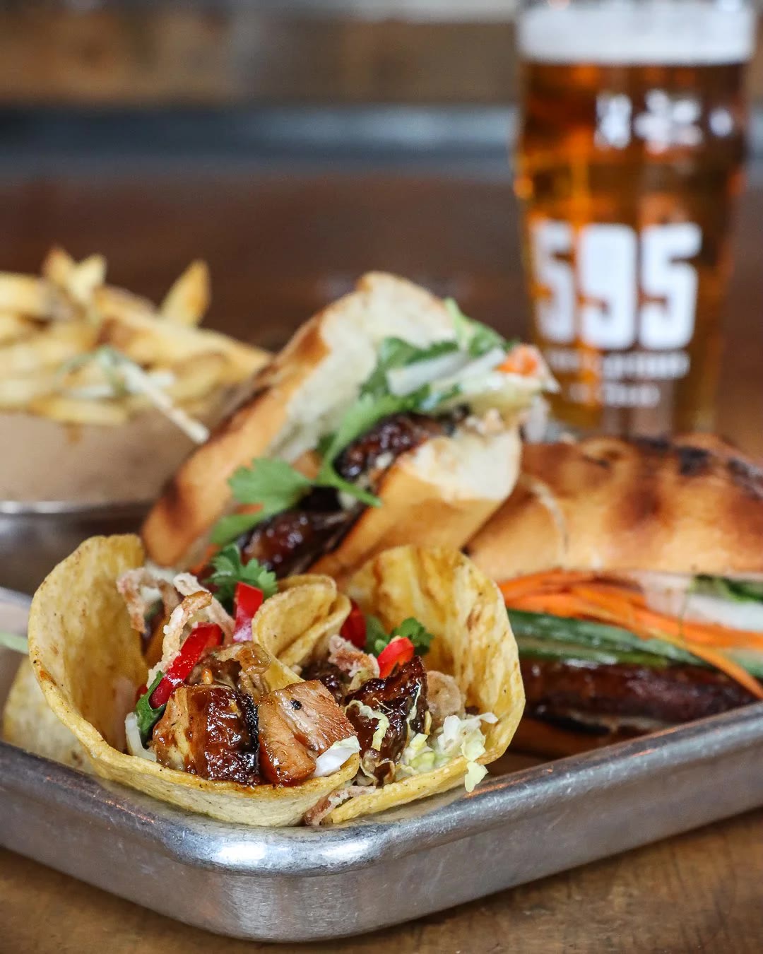 Pork belly plate with beer at 595 Craft and Kitchen (official venue photo)