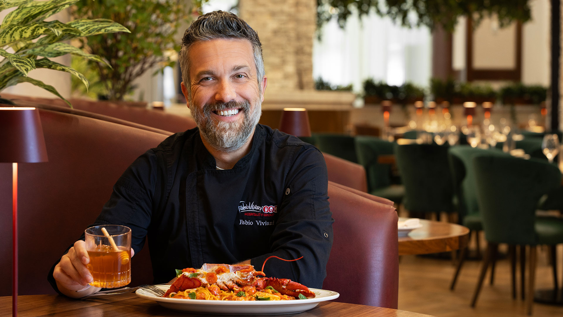 Chef Fabio Viviani with lobster pasta at ai Pazzi (official venue photo)