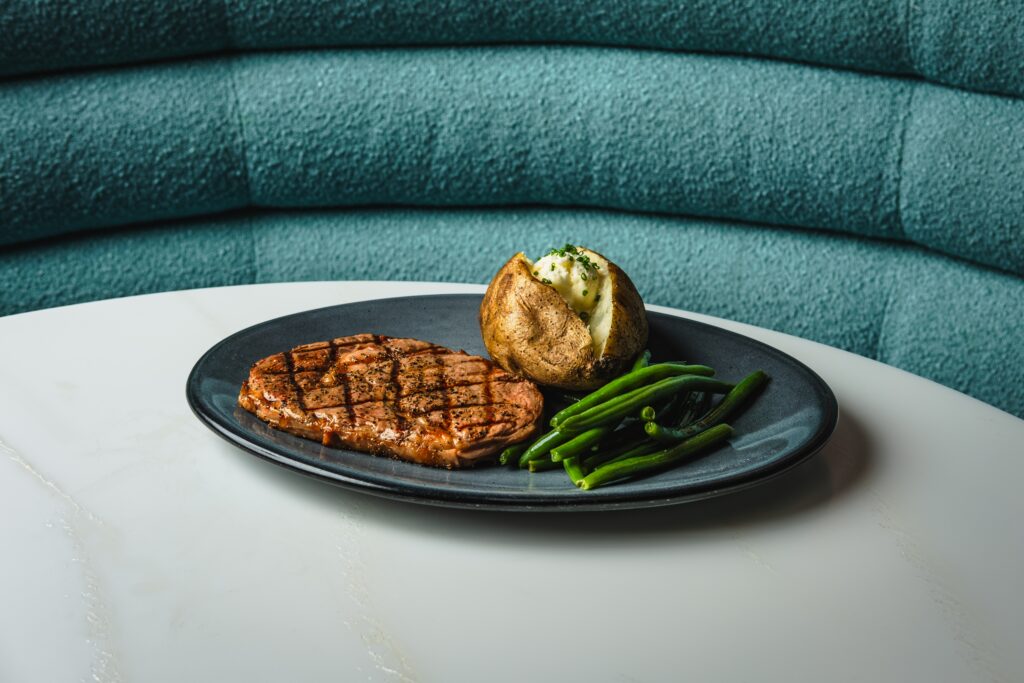 Rib eye special at America Restaurant & Bar (Jose Salinas via Food & Loathing)