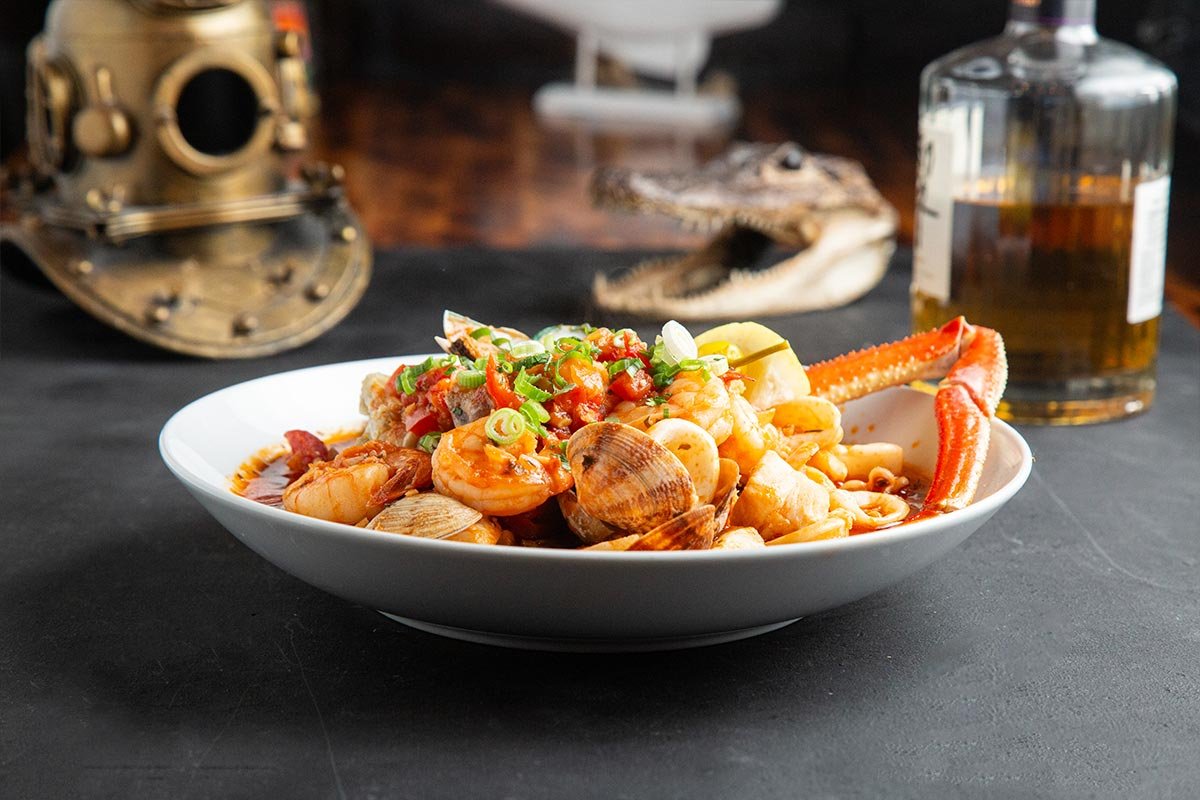 Bowl of seafood stew with clams, shrimp and crab legs at The Legends Oyster Bar & Grill (official photo)