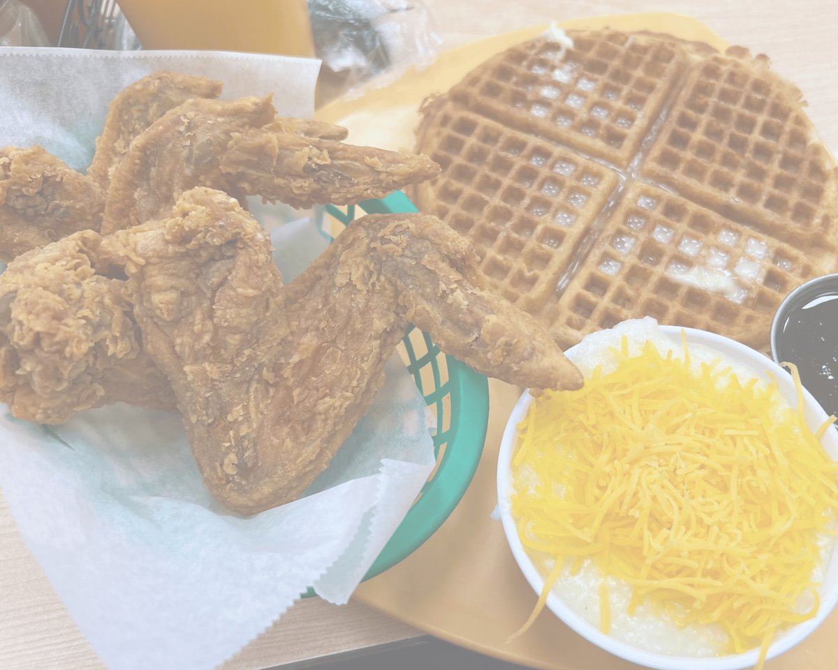 Fried chicken with a waffle and a bowl of cheesy grits at Gritz Cafe (official photo)