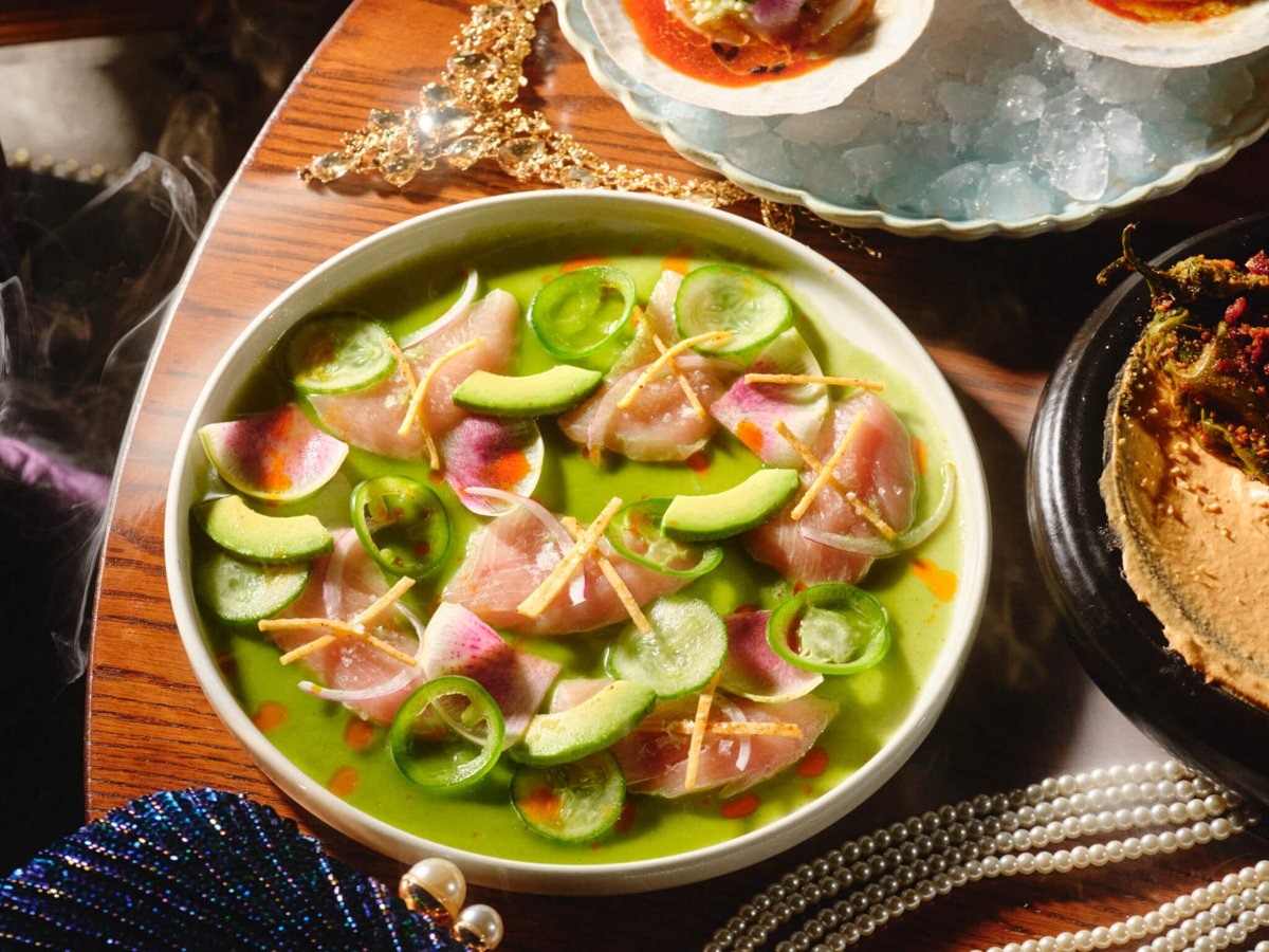 A bowl of sliced raw fish with cucumber and avocado in a green sauce at Beauty & Essex (official photo)
